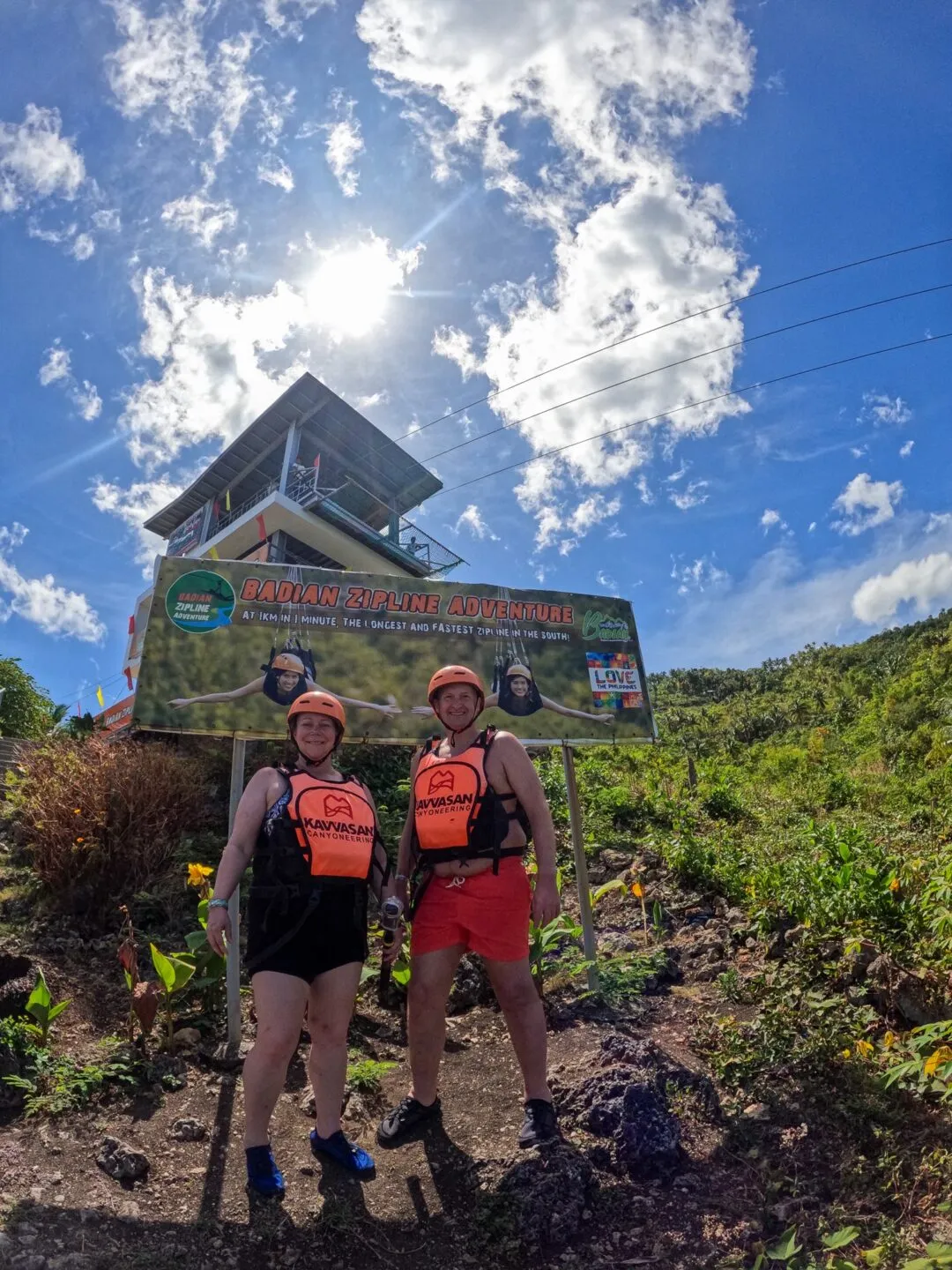 Zipline tower sunburst clouds cebu